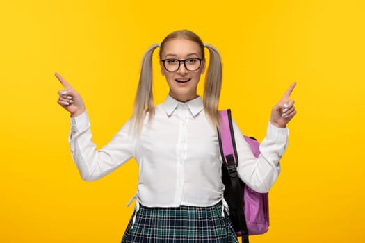 world book day blonde girl with ponytails wearing glasses with pink backpack