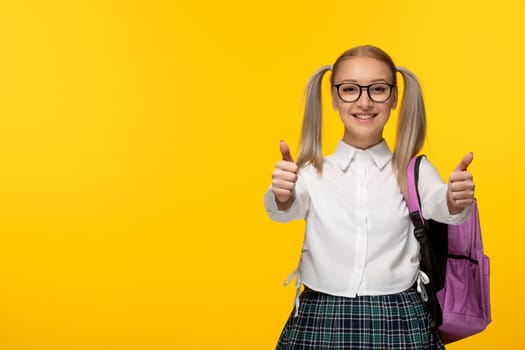 world book day cheerful school girl with pony tails showing great hand gesture
