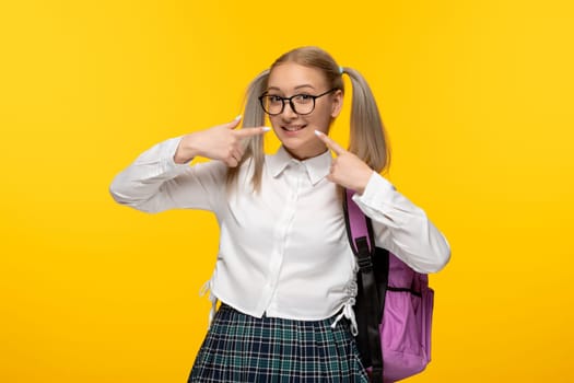 world book day cheering smiling cute schoolgirl in uniform