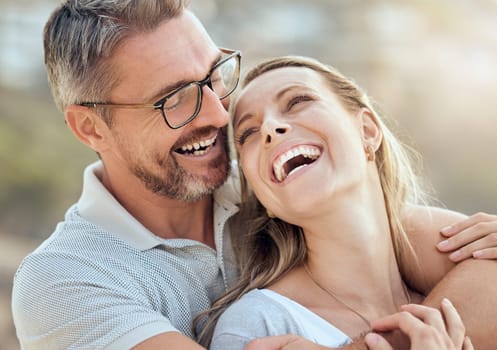Happy, smile and laughing with couple at beach for love, travel and summer vacation. Happiness, holiday and romance with man and woman hugging on seaside date for bonding, affectionate and care.