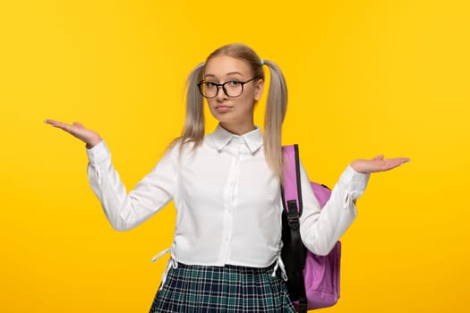 world book day school girl blonde with waving hands and pony tails