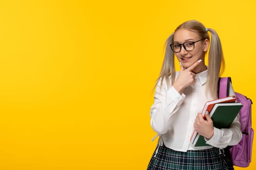 world book day thinking schoolgirl with glasses and books