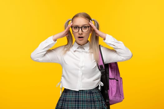 world book day tired and annoyed student in uniform with pink backpack