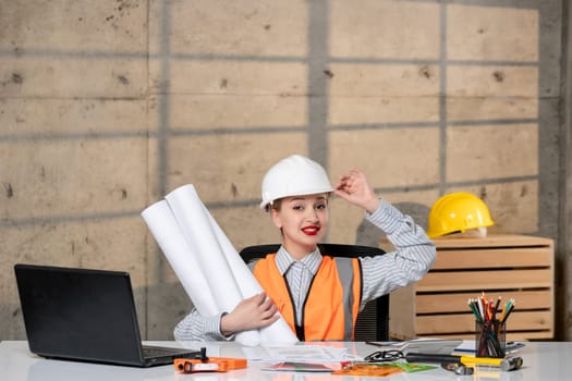 engineer blonde young cute smart girl civil worker in helmet and vest happy