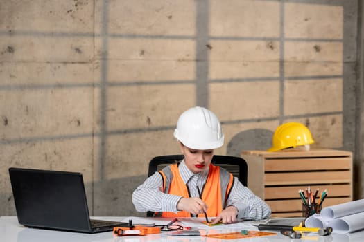 engineer young smart cute blonde girl civil worker in helmet and vest