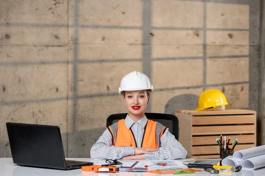 engineer civil worker in helmet and vest smart young cute blonde girl excited