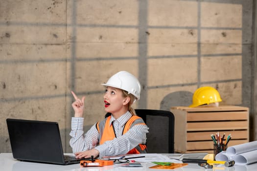 engineer civil worker in helmet and vest smart young cute blonde girl happy