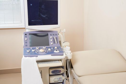 Interior of medical room with ultrasound diagnostic equipment. High quality photo