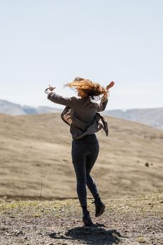 Shot of a cheerful young woman enjoying the outdoors.