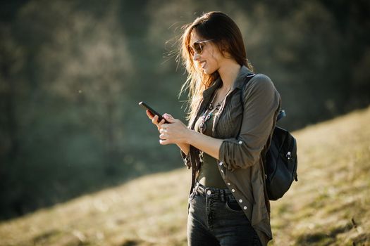 Shot of a carefree young woman enjoying the outdoors.