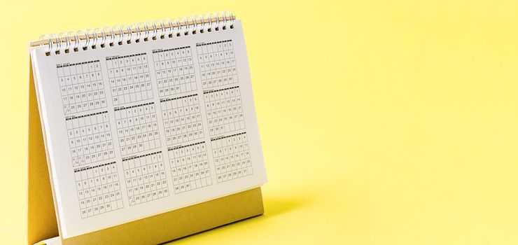 Desktop calendar 2021 on yellow background with empty space for your text or message.