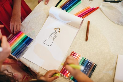 Children drawing with markers and having fun
