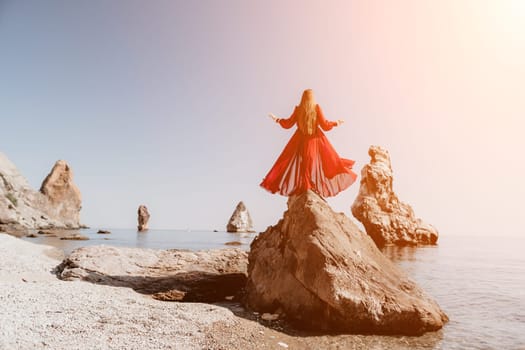 Woman travel sea. Happy tourist taking picture outdoors for memories. Woman traveler looks at the edge of the cliff on the sea bay of mountains, sharing travel adventure journey.