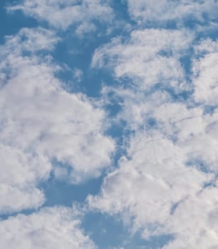 Background of blue sky with white clouds. Natural backdrop