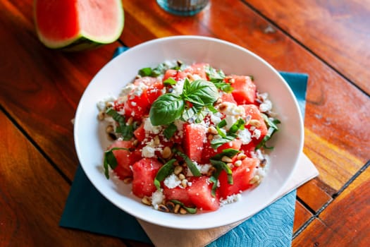 Watermelon feta salad on a wooden table. High quality photo