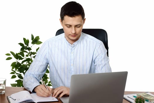 businessman in blue shirt taking notes, doing market research working in office