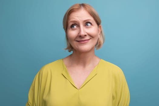 portrait of middle aged blond woman with bob hairstyle.