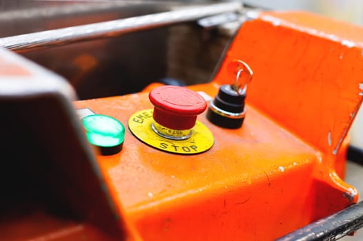 Close-up of the buttons on the control panel of the machine. Start or stop production equipment using the control panel. Panel with button to control production machines.