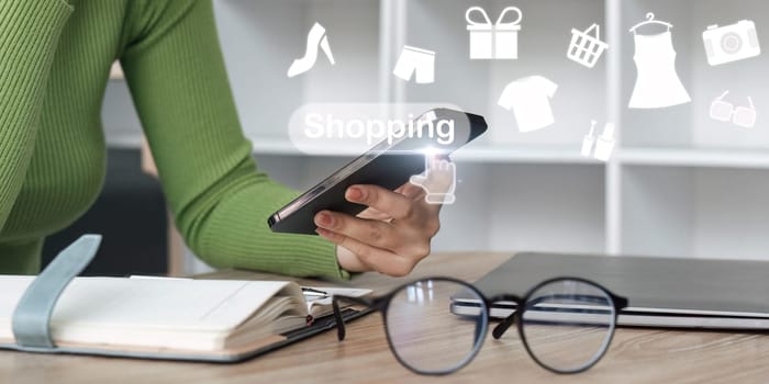 Online shopping concept. woman with shopping cart for online shopping on virtual screen.