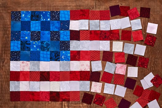 Square pieces of fabrics lying like a flag of USA