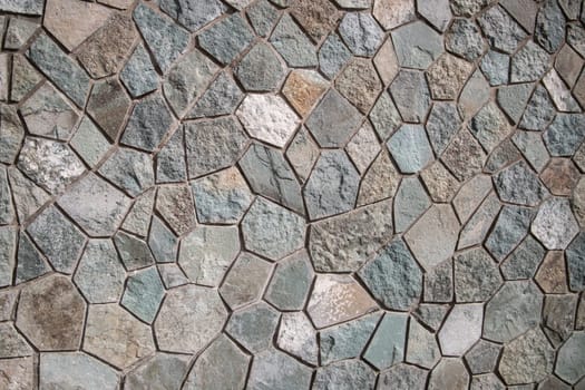 The facade wall of the basement is neatly finished with natural stone flagstone.