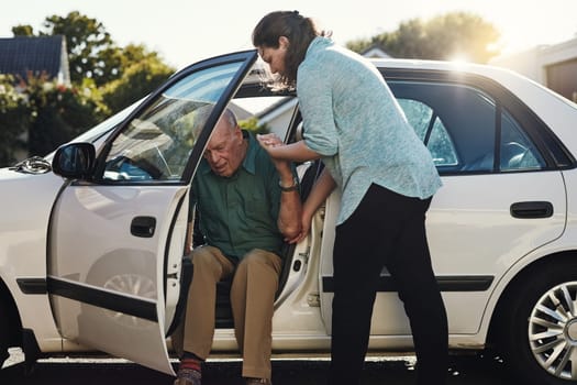 Car, help and woman with senior man for assisted living, retirement care and rehabilitation. Travel, transportation and female caregiver helping elderly male person from motor vehicle for assistance.