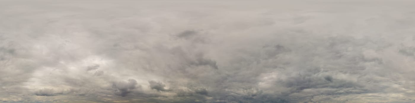 Sky panorama on overcast rainy day with low clouds in seamless spherical equirectangular format. Complete zenith for use in 3D graphics, game and for aerial drone 360 degree panorama as a sky dome.