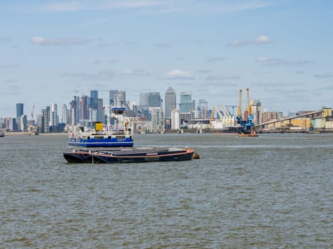 Woolwich, London - 15 May 2023: Car Ferry approaches Woolwich Ferry terminal on Thames