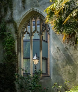 London street lamp in carved window of St Dunstan church in City of London