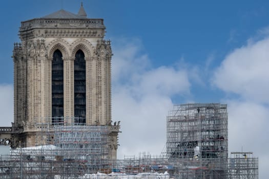 6 May 2023. Paris, France. Gothic tower and facade of Notre Dame emerges from scaffolding as restoration on the cathedral continues. Work is expected to be completed by December 2024. Roof top view