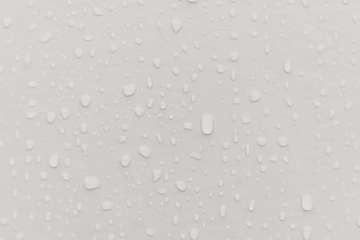 Water drops an gray surface. Abstract water drops background