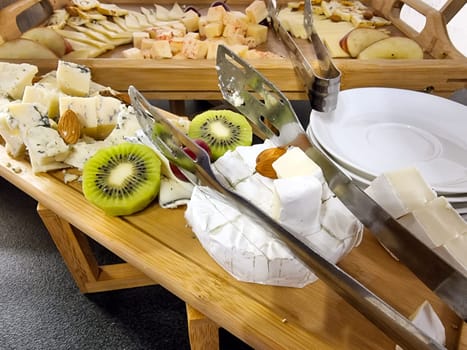 Cheese platter with organic cheeses - blue cheese cheddar, emmantaler,