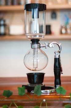 Siphon coffee maker exposed on the bar of a cafeteria. High quality photo