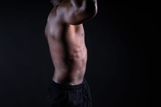 Muscle, body and skin, portrait of black man on dark background with serious face art aesthetic.