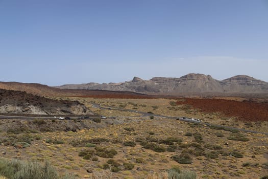 Panoramic view of volcanic lanscape in front of the ocean from the peak of mountain Teide, Tenerife, Canary islands, Spain