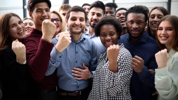 Confident diverse college students show fist up. success concept