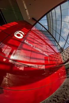 London, United Kingdom - February 10, 2007: Extreme wide (fisheye) photo, red wall of 6 More London Place building designed by Foster and Partners. Example of modern architecture in UK capital.