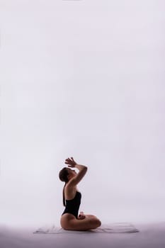 Beautiful woman doing poses on a yoga class. Studio shot.