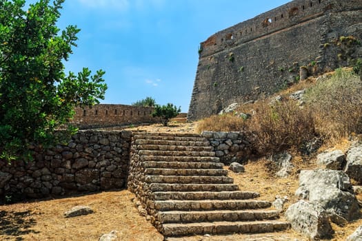 Nafplio, Greece Palamidi fortification staircase detail before the bastion on a bright summer day.