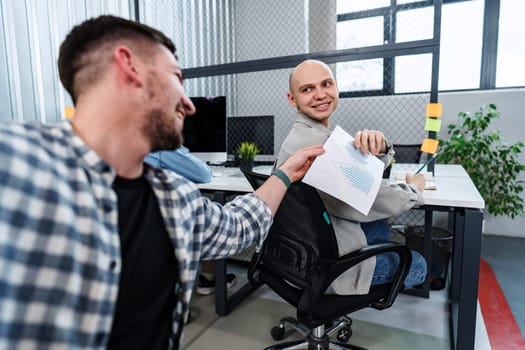 Businessman passing over paper to his colleague in office, close up