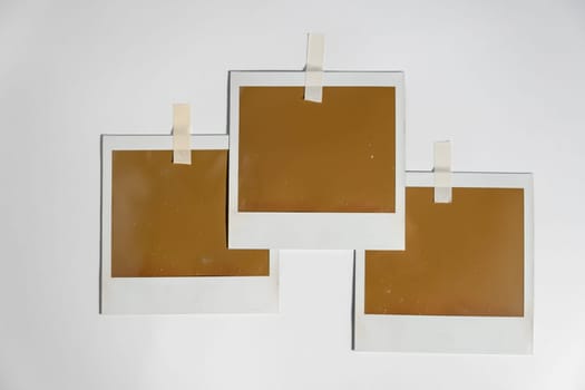 Three blank photo frames on white background. download photo