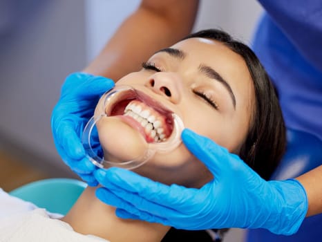 Comfort comes first. a young woman having a dental procedure performed on her