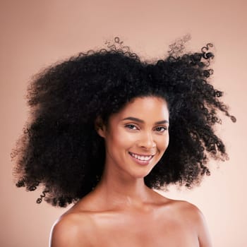 Happy black woman, portrait or afro hair on studio background in aesthetic empowerment, curly texture pride or skincare glow. Beauty model face, smile or natural hairstyle and makeup on isolated wall.