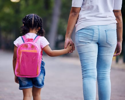Holding hands, mom and child walking to school, help and care with support outdoor, education and growth. Kindergarten, development in childhood and backpack, family, woman with girl in the morning.