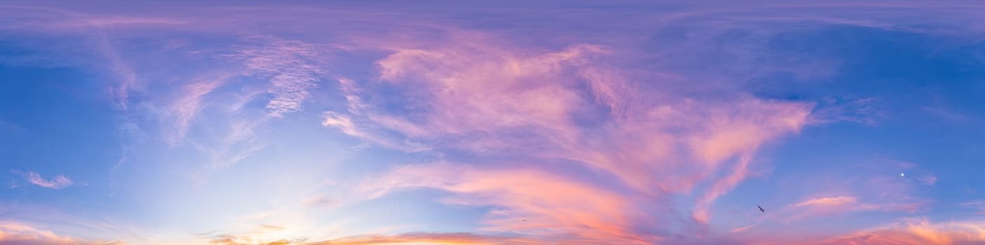 Bright sunset sky panorama with Cirrus clouds. Seamless hdr spherical equirectangular 360 panorama. Sky dome or zenith for 3D visualization, game and sky replacement for aerial drone 360 panoramas.