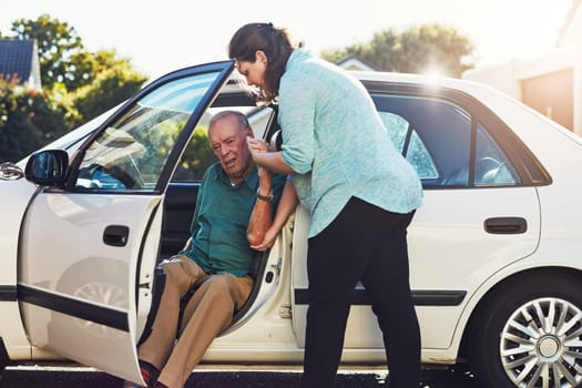 Car, transport and caregiver help old man for assisted living, retirement care and rehabilitation. Travel, transportation and woman helping elderly male person from motor vehicle for health service.