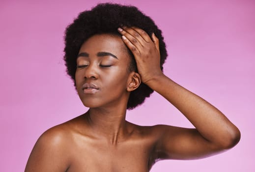 Model, touching and afro hairstyle on beauty studio background in relax skincare, texture maintenance or salon wellness. Black woman, natural and hair growth hands on isolated pink or makeup backdrop.