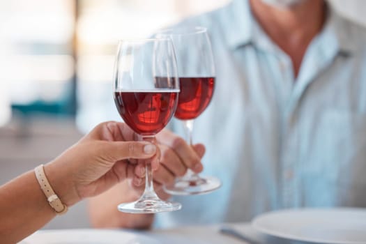 Hands, wine glasses and cheers for celebration dinner, date or table in thanks for fine dining at home. Hand of couple toasting with wine for relationship, romance and clinking glass for dating love.