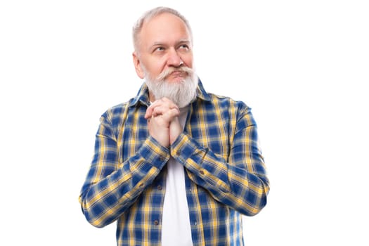 handsome senior pensioner gray-haired man with a beard in a shirt on a white background.