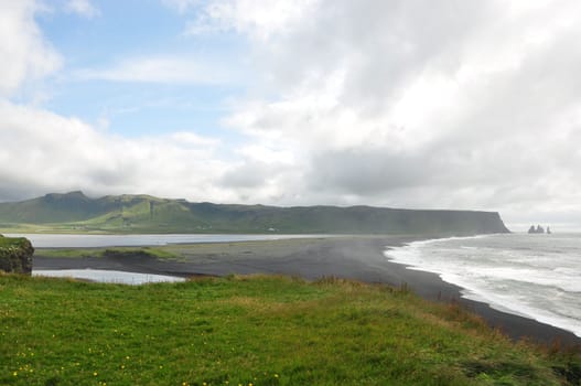 Scenic view of peninsula and a coast in Dyrholaey Cape Portland Iceland